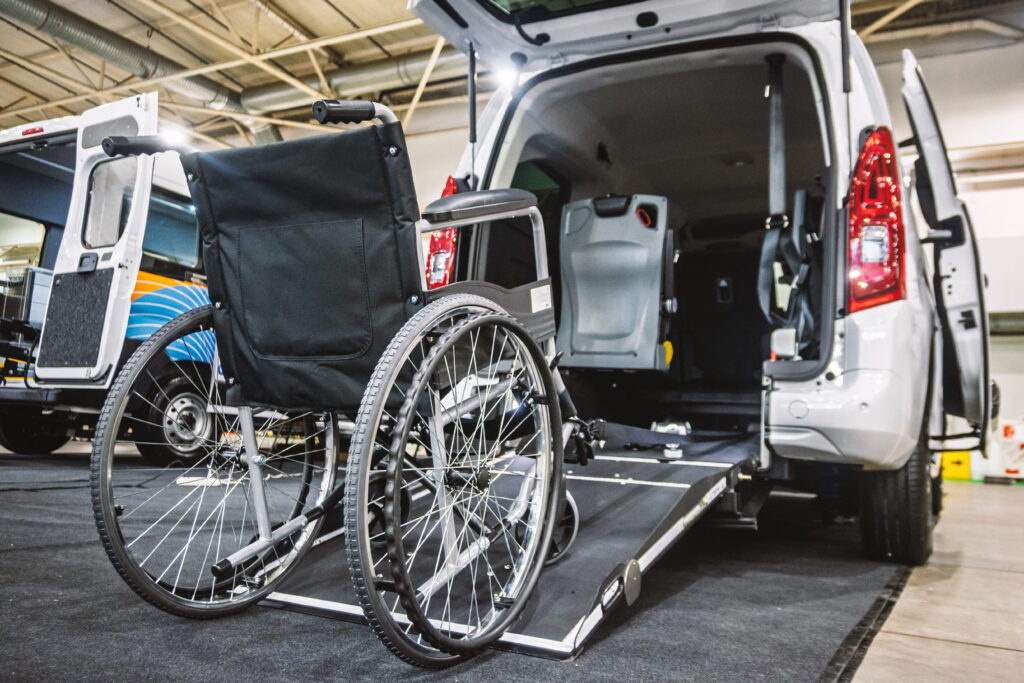 Modern accessible vehicle with an open ramp and wheelchair ready for transport